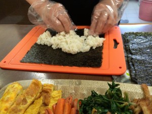 spreading rice for kimbap